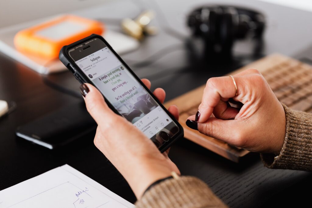 Woman using smartphone at table